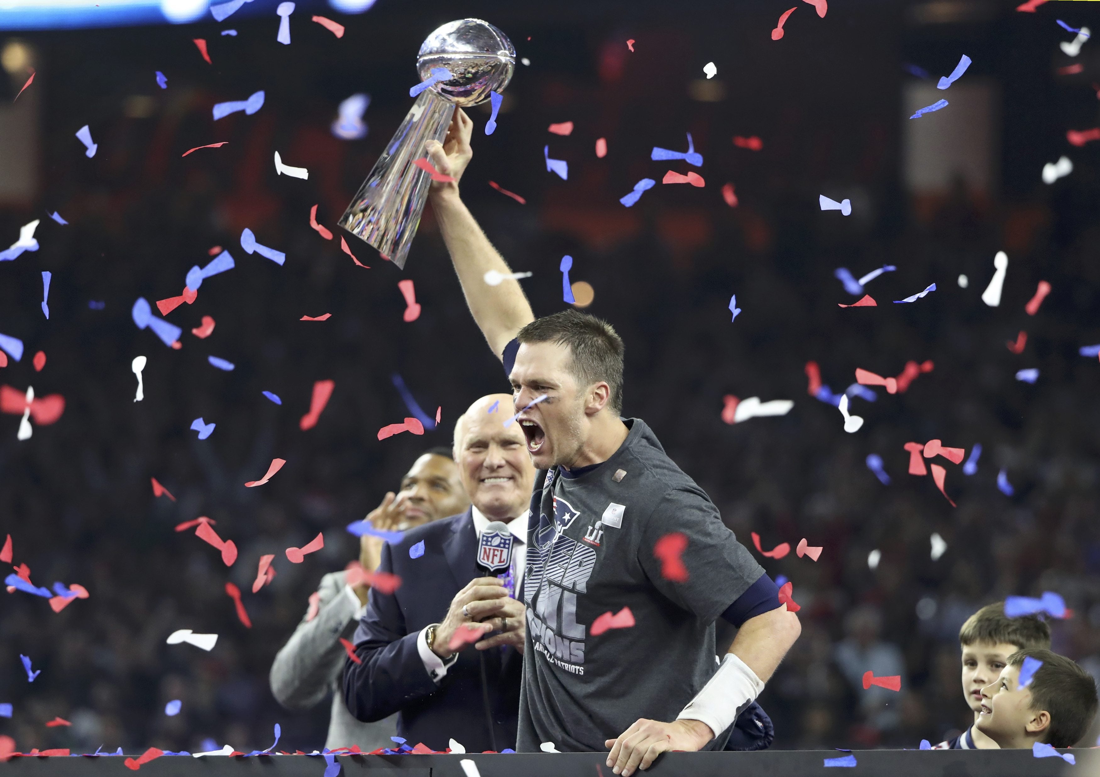 Tom Brady 1st Super Bowl,  quarterback Tom Brady holds Lombardi Trophy  after winning Super Bowl