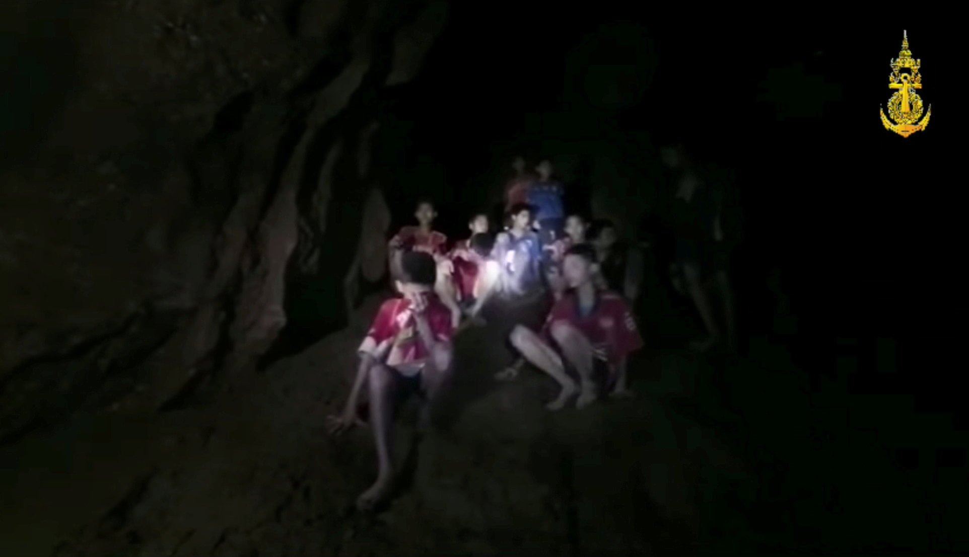 Boys from an under-16 soccer team and their coach wait to be rescued after they were trapped inside a flooded cave in Chiang Rai
