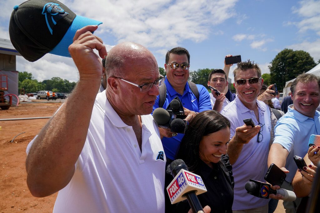 Carolina Panthers players push owner David Tepper for grass field