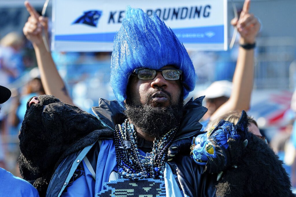 Fans tailgate ahead of an NFL football game, between the Atlanta