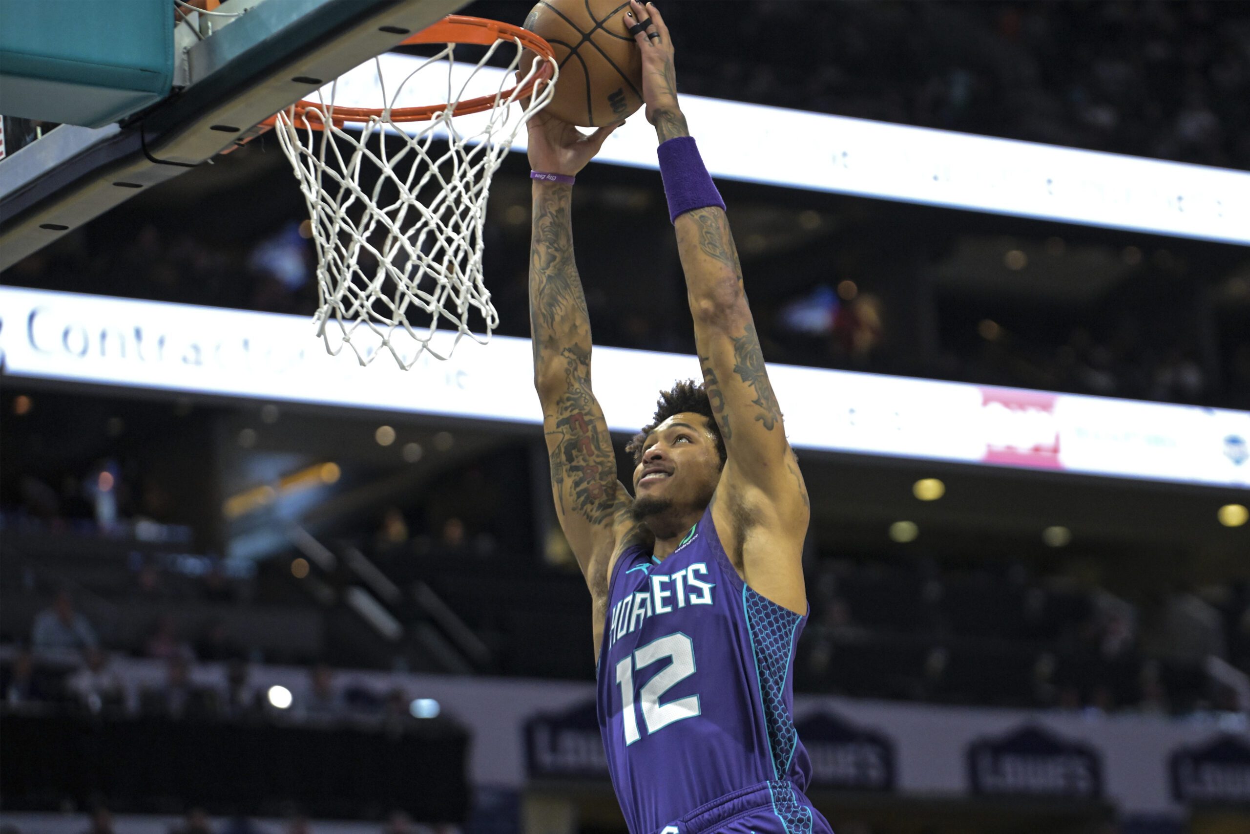 Charlotte Hornets guard Kelly Oubre Jr. warms up before an NBA