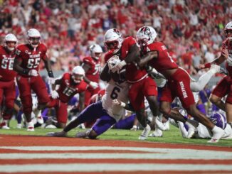 Jordan Waters (#7) forces his way into the end zone to put the NC State Wolfpack up 31-21 against the Western Carolina Catamounts.